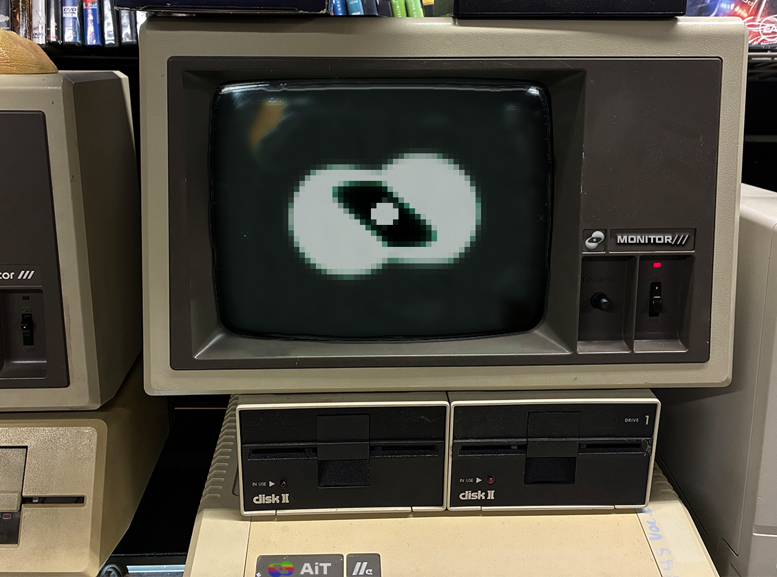 A vintage home computer setup evoking a wafer glowing as one giant chip